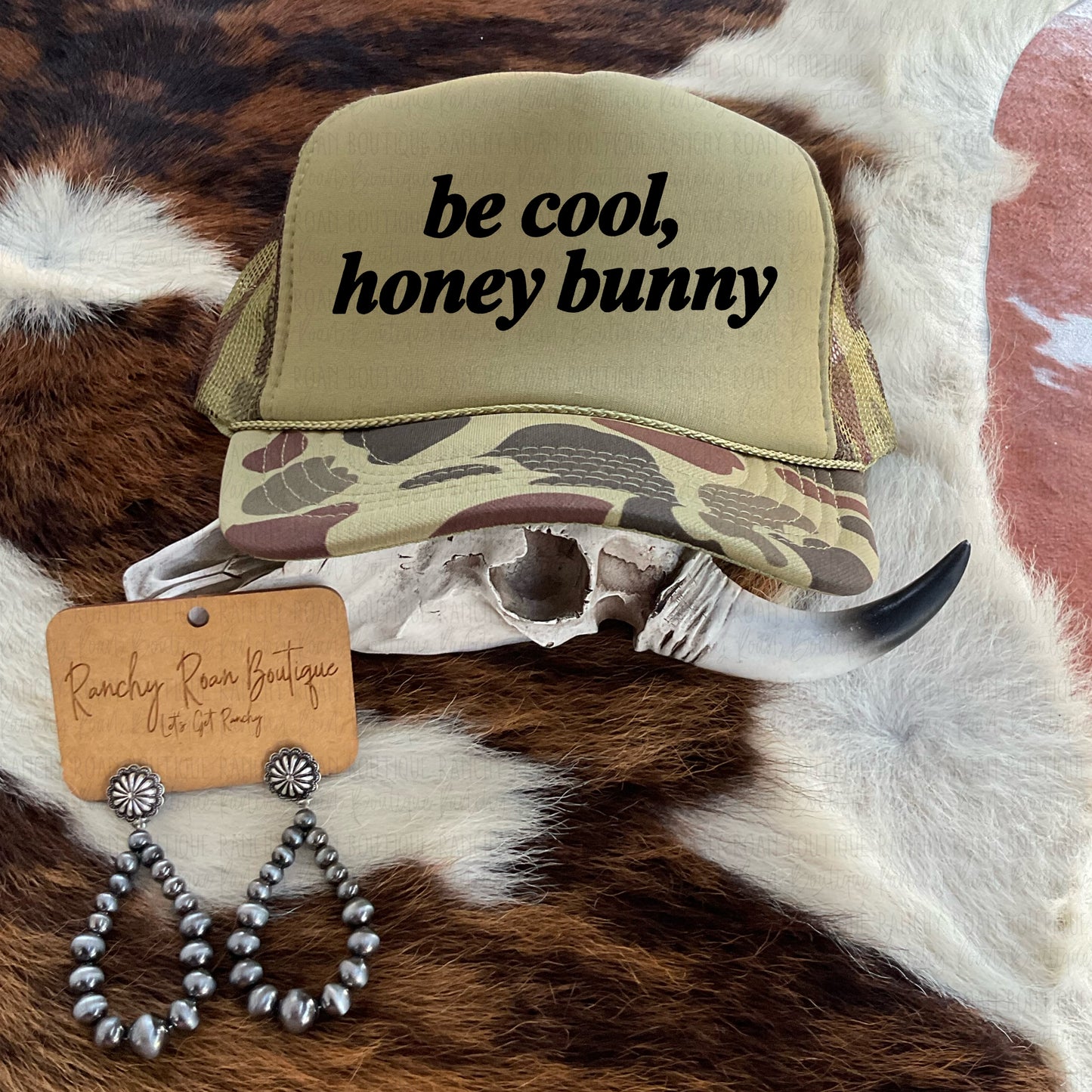 Foam trucker hat featuring a breathable mesh back and “Be Cool, Honey Bunny” sublimation design. Perfect for boutique buyers.