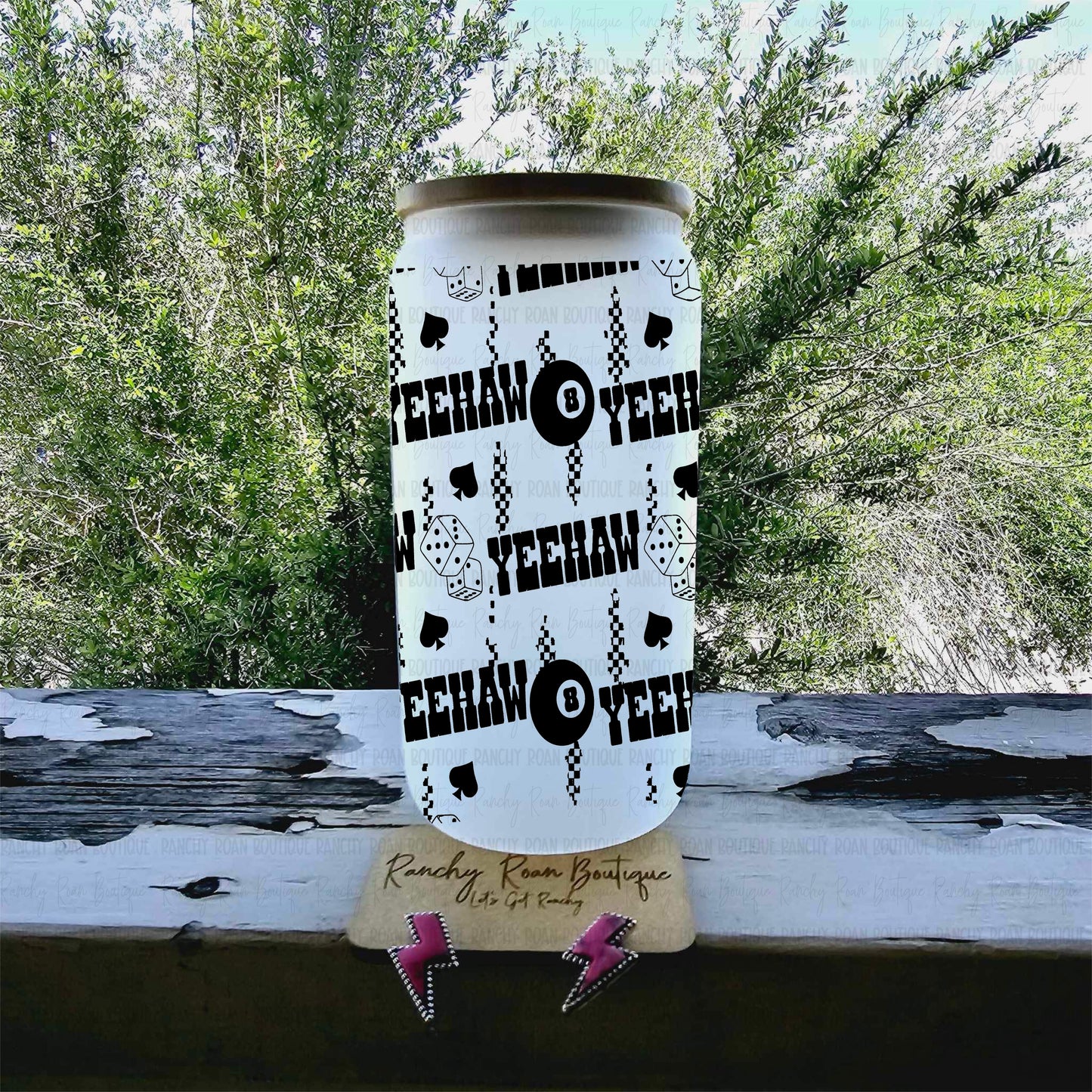 Frosted glass can tumbler featuring black Yeehaw, dice, spades, and 8-ball Western graphics, with bamboo lid and straw