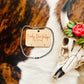 4mm Navajo Style Pearl Choker Necklace in burnished silver with multicolor accents, displayed with a decorative skull on a cowhide background.