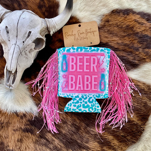 Western-style can cooler with neon Beer Babe lettering, available in regular and slim sizes, with or without fringe.