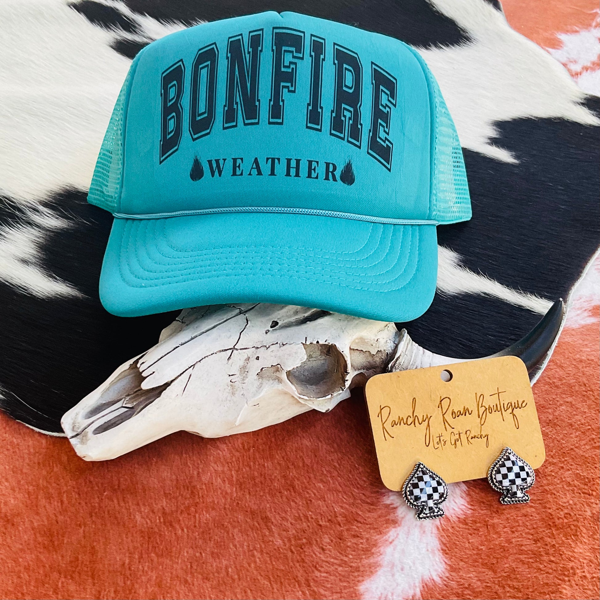 Foam front trucker hat with the bold text “Bonfire Weather” and adjustable snapback closure, featuring breathable mesh and a classic Western style.