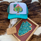 Cactus Turquoise Spade Western Trucker Hat featuring a colorful cactus graphic framed by a spade shape, styled on a rustic background with turquoise accents.