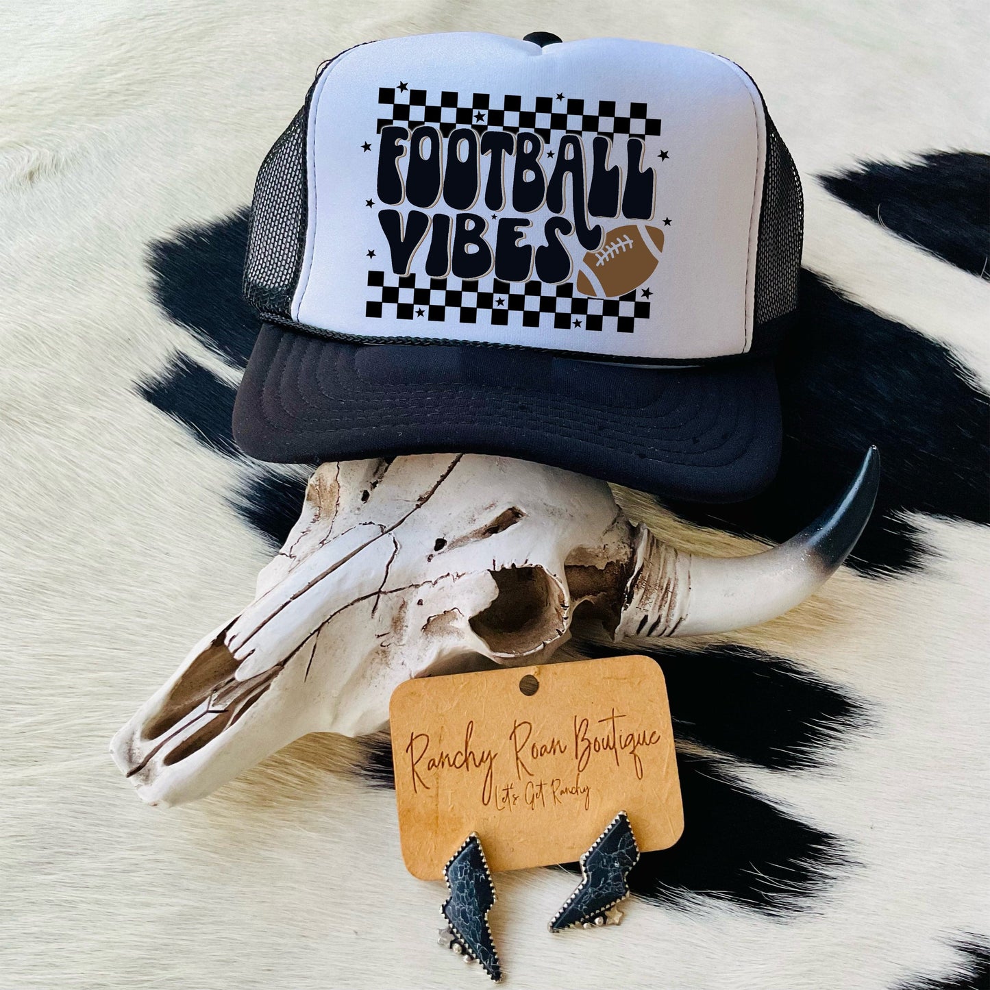 Front view of the Football Vibes Checkered Western Trucker Hat featuring a bold “Football Vibes” graphic on a checkered background.