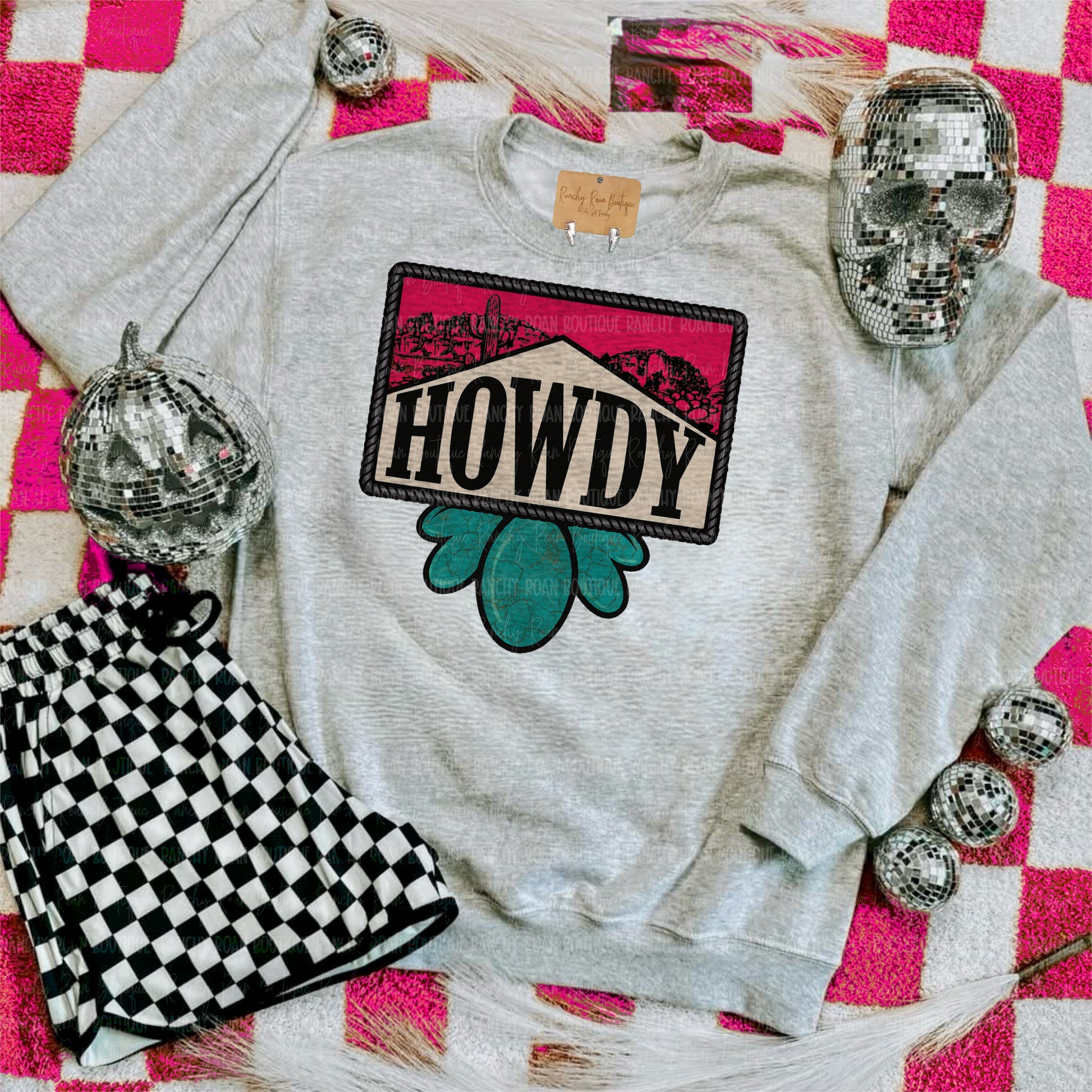 Gray sweatshirt with 'HOWDY' graphic on a checkered background Howdy Desert Stone Western Graphic Sweatshirt