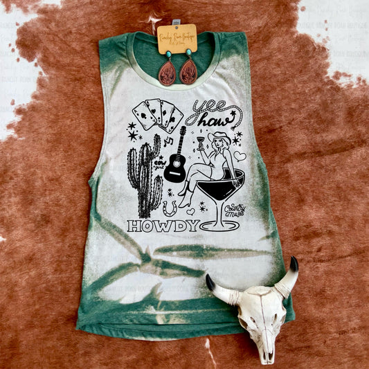Green and white bleached Western graphic muscle tank with a fun cowgirl design, styled with cowhide and skull decor.