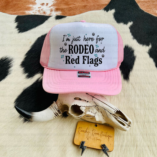 I’m Just Here for the Rodeo and Red Flags Western Trucker Hat