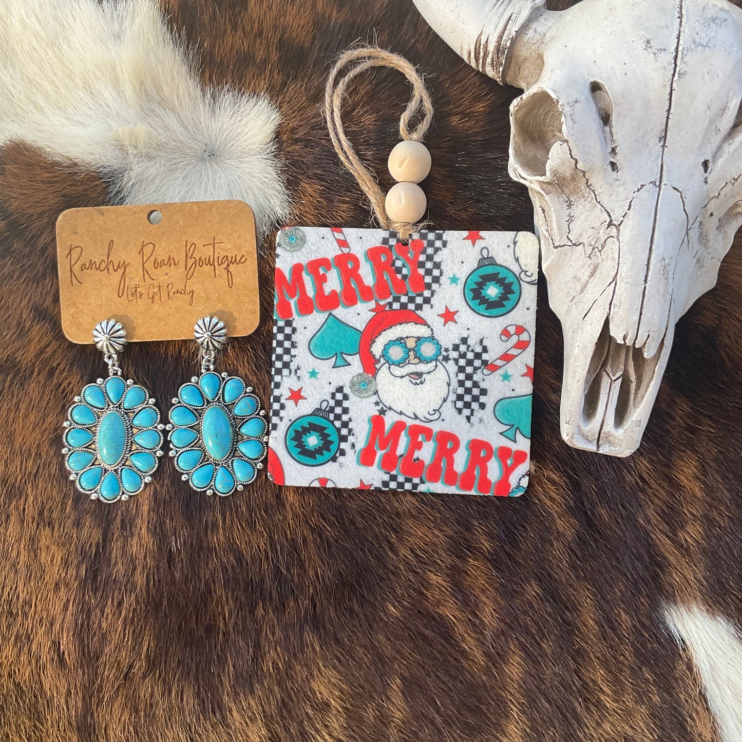 Merry Cowboy Christmas Felt Freshie featuring turquoise Santa design with “Merry Merry” text, candy canes, and checkered accents beside turquoise earrings.