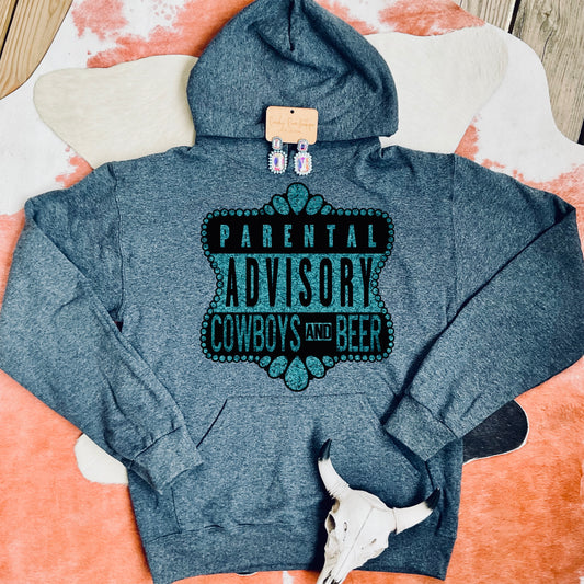 Comfortable unisex hoodie in a heather gray color featuring the bold “Parental Advisory: Cowboys and Beer” design in teal lettering, styled with Western accents.