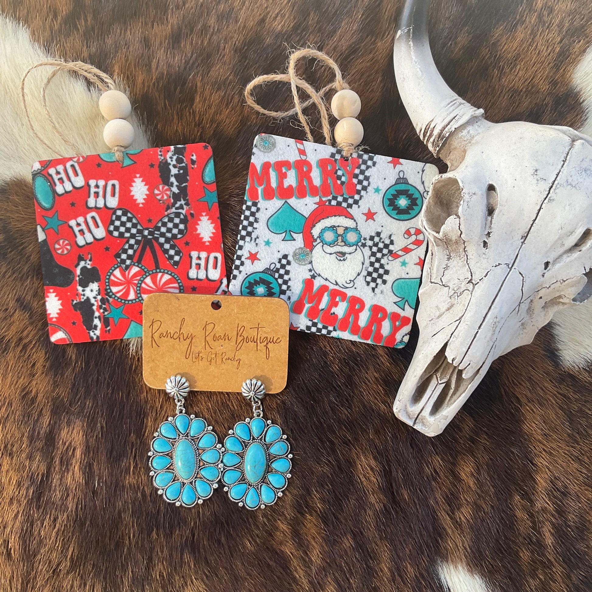 Western felt Christmas freshies on a rustic background with decorative cards and a skull.