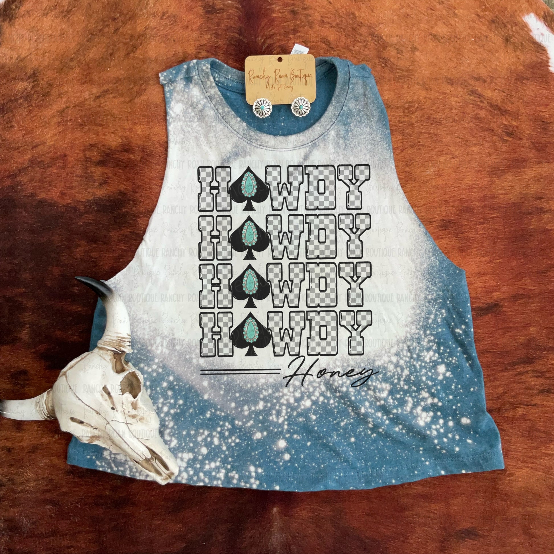 Deep teal Western crop top with bleach splash and “Howdy Honey” sublimated graphic featuring checkerboard letters and turquoise spade icons